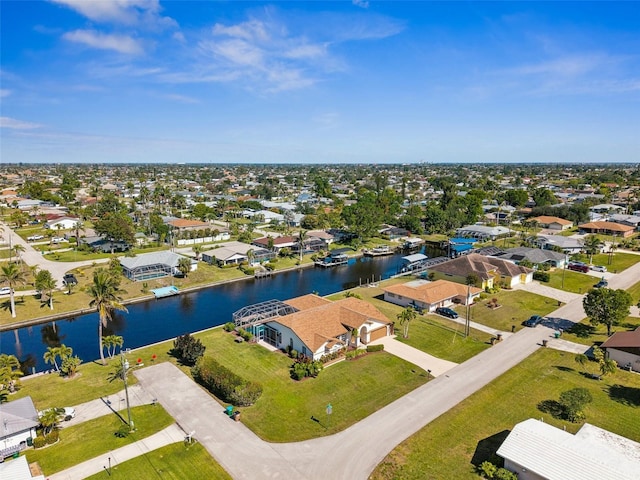 birds eye view of property featuring a water view and a residential view