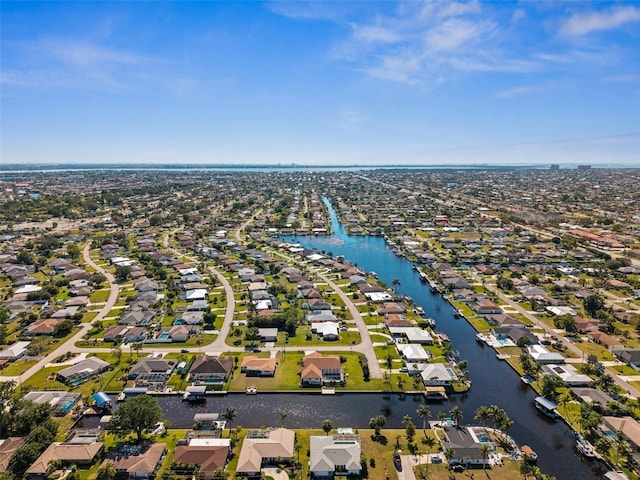 drone / aerial view with a water view and a residential view