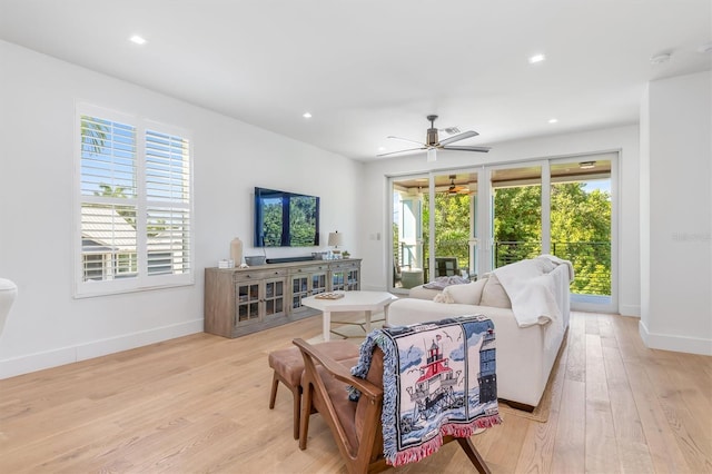 living area with recessed lighting, baseboards, ceiling fan, and light wood finished floors