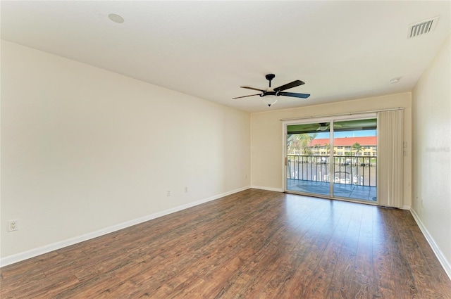 unfurnished room with a ceiling fan, baseboards, visible vents, and wood finished floors