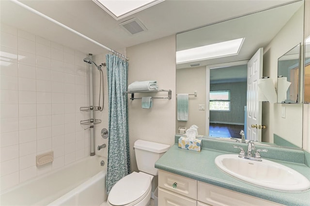 bathroom with shower / bath combination with curtain, visible vents, vanity, and toilet