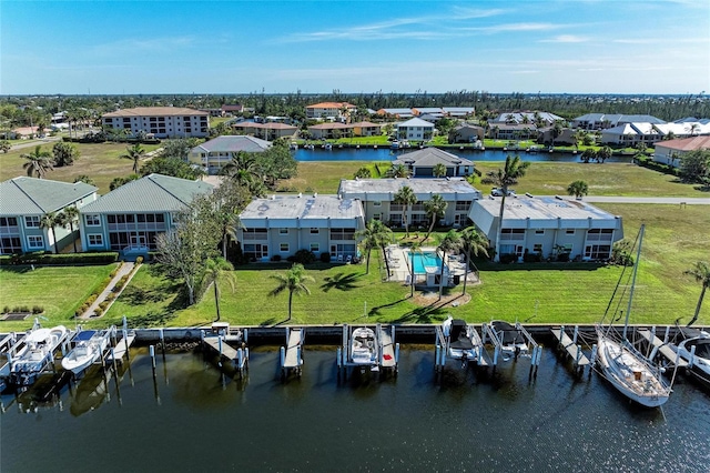 drone / aerial view featuring a water view and a residential view