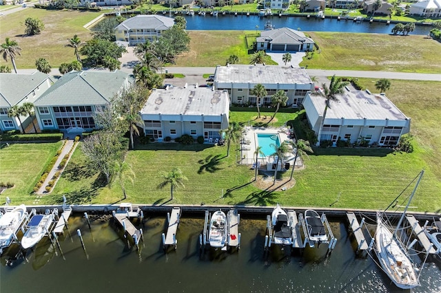 bird's eye view with a water view and a residential view