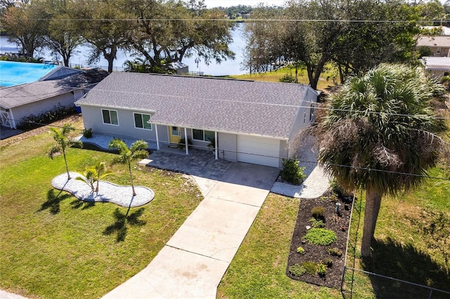 drone / aerial view featuring a water view