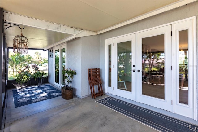 exterior space with french doors, a patio area, and stucco siding