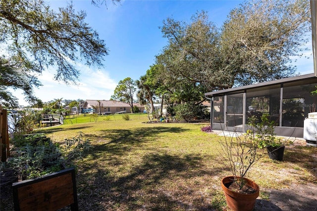 view of yard with a sunroom