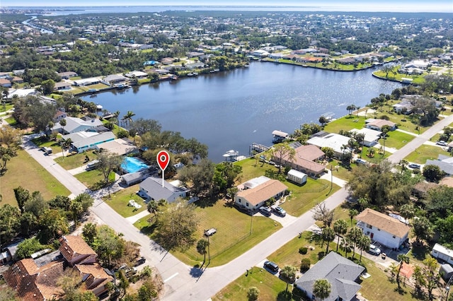 drone / aerial view featuring a water view and a residential view