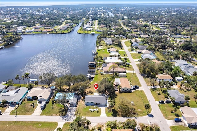 aerial view featuring a water view and a residential view