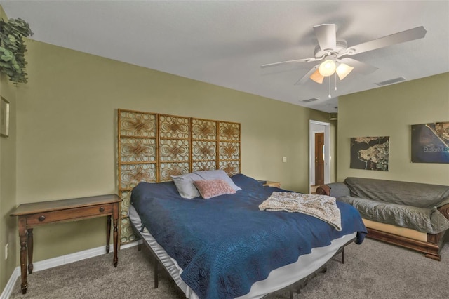 bedroom with carpet floors, baseboards, visible vents, and a ceiling fan