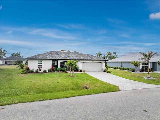 ranch-style house with a front yard, decorative driveway, an attached garage, and stucco siding