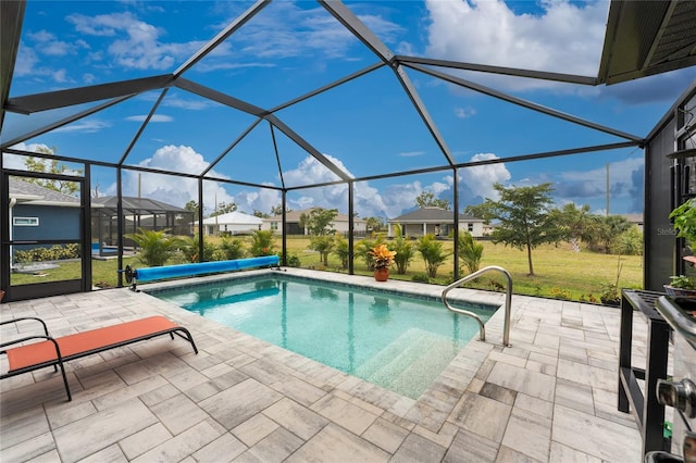 16265 Juarez Cir, Punta Gorda, FL 33955 - view of swimming pool featuring a covered pool, a patio area, a lanai, a yard, and a residential view