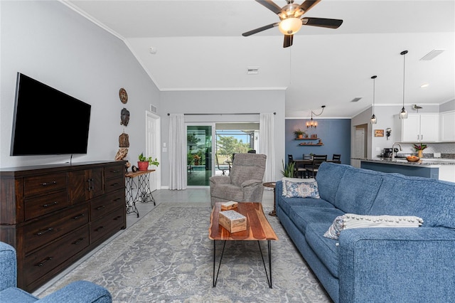 16265 Juarez Cir, Punta Gorda, FL 33955 - living room with ceiling fan, visible vents, vaulted ceiling, tile patterned floors, and ornamental molding