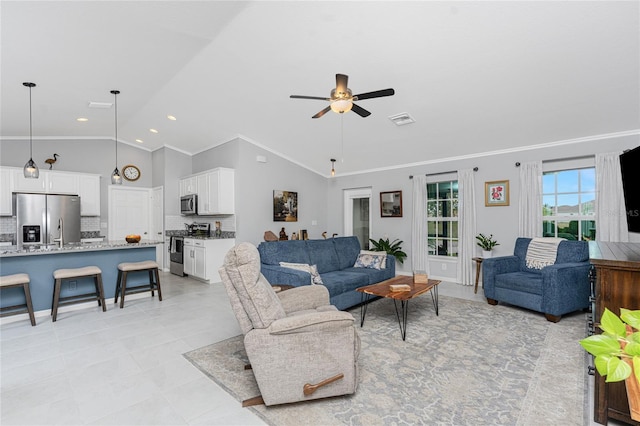 16265 Juarez Cir, Punta Gorda, FL 33955 - living room featuring a ceiling fan, visible vents, ornamental molding, and lofted ceiling