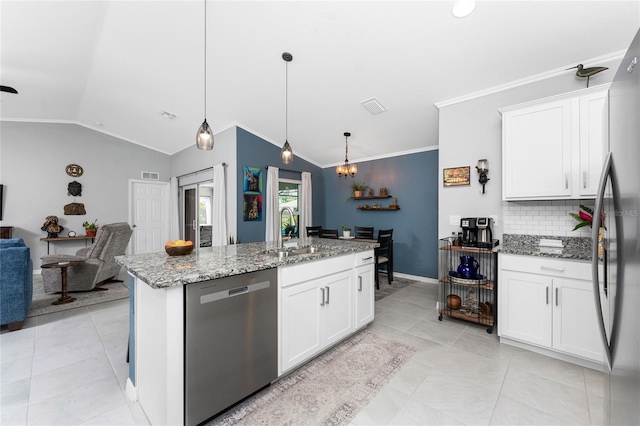 16265 Juarez Cir, Punta Gorda, FL 33955 - kitchen with appliances with stainless steel finishes, a sink, lofted ceiling, backsplash, and ornamental molding