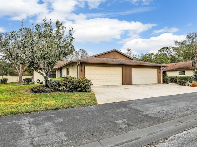 single story home featuring driveway and a front yard