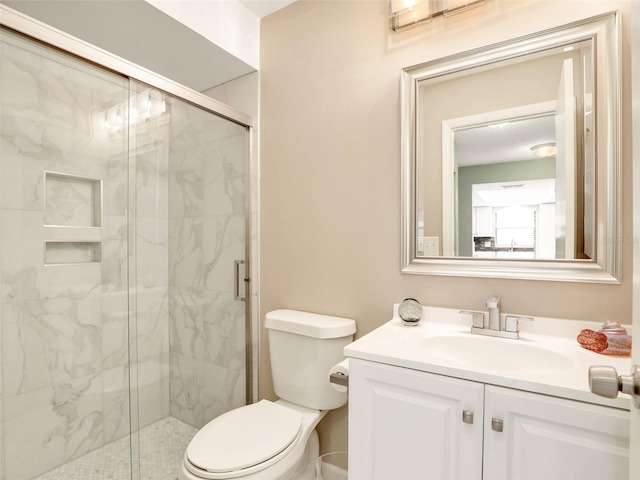 full bath featuring toilet, a marble finish shower, and vanity