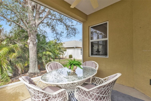 view of patio / terrace featuring a ceiling fan and outdoor dining space