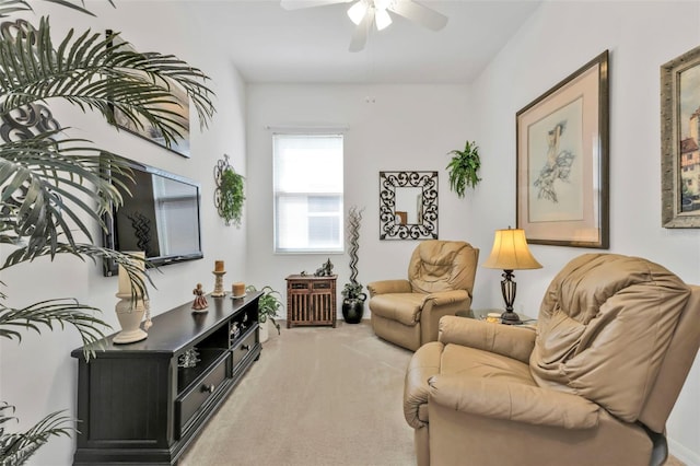 sitting room featuring carpet flooring and ceiling fan