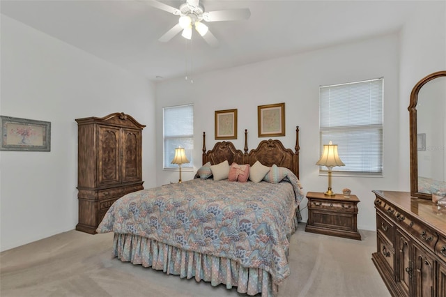 bedroom with light carpet and ceiling fan