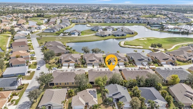 bird's eye view with a residential view and a water view