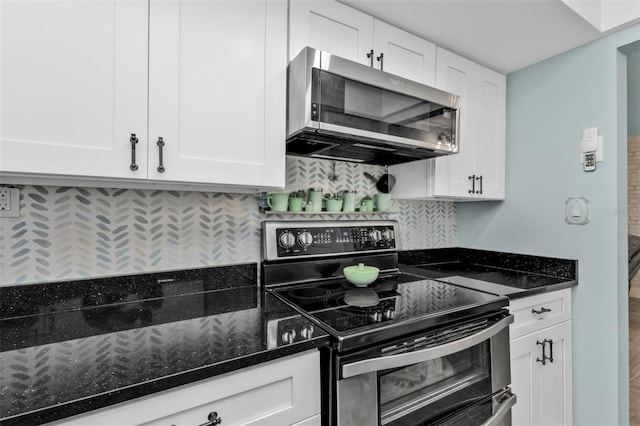 21287 Gertrude Ave Unit 106, Port Charlotte, FL 33952 - kitchen featuring dark stone counters, stainless steel appliances, and white cabinets