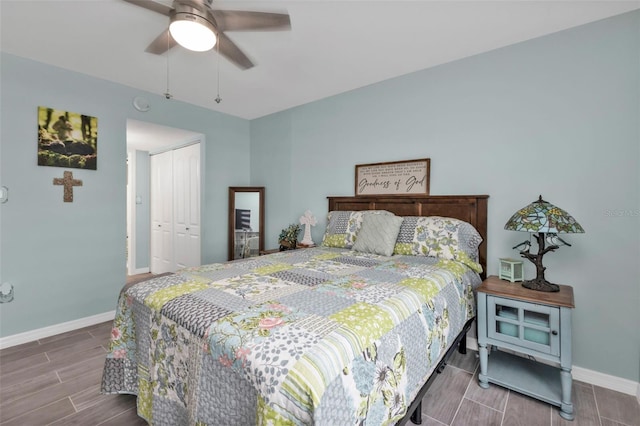 21287 Gertrude Ave Unit 106, Port Charlotte, FL 33952 - bedroom featuring a ceiling fan, wood tiled floor, a closet, and baseboards