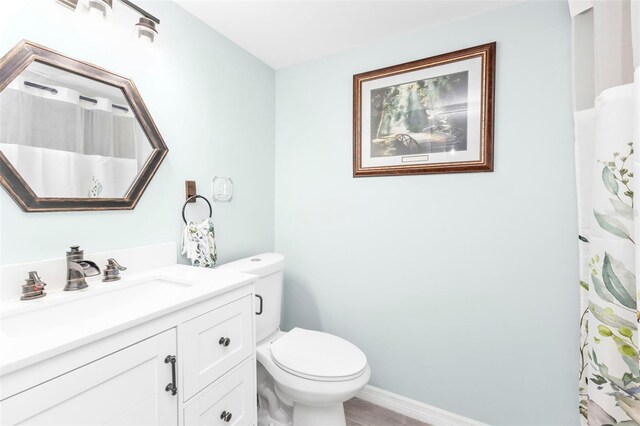 21287 Gertrude Ave Unit 106, Port Charlotte, FL 33952 - full bathroom with vanity, toilet, and baseboards