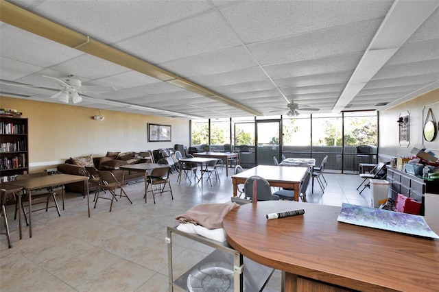 21287 Gertrude Ave Unit 106, Port Charlotte, FL 33952 - tiled dining space featuring a ceiling fan and a drop ceiling