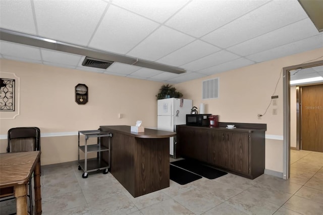 21287 Gertrude Ave Unit 106, Port Charlotte, FL 33952 - interior space featuring a paneled ceiling, visible vents, and baseboards