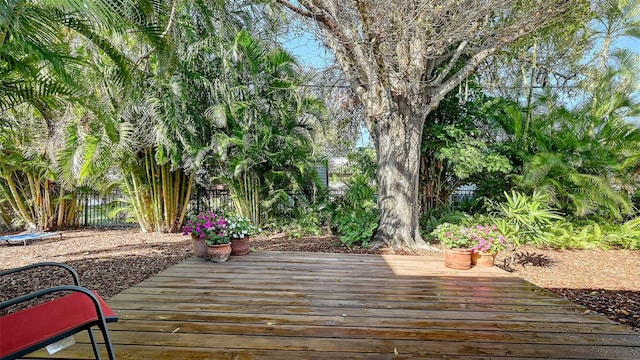 wooden deck featuring fence