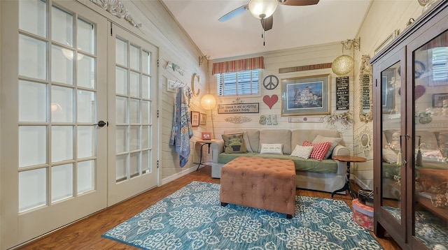 living area featuring ceiling fan, french doors, and wood finished floors