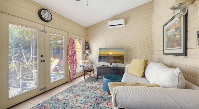 interior space with a wall unit AC, light tile patterned floors, and wood walls