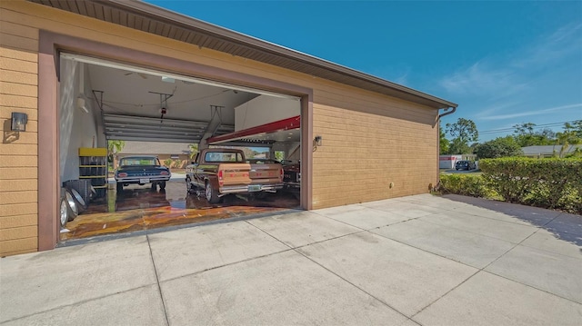 garage featuring driveway