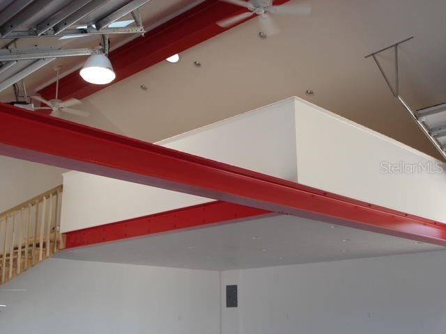 interior details featuring beam ceiling and ceiling fan