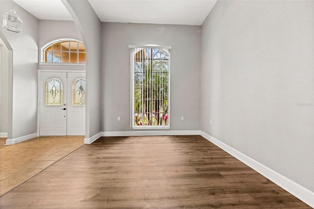 entryway with hardwood / wood-style flooring