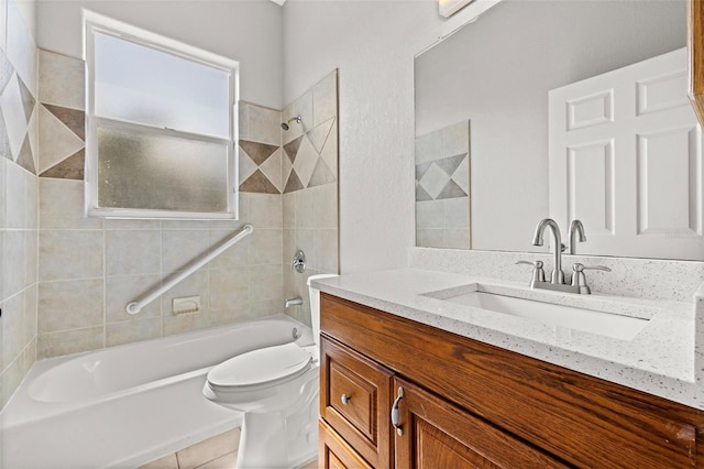 full bathroom with toilet, vanity, and tiled shower / bath combo