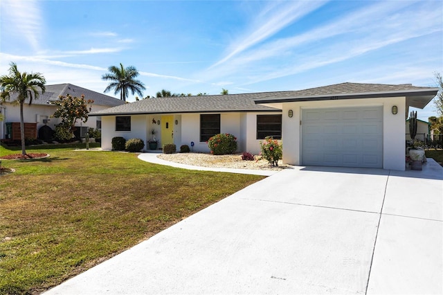 ranch-style house with driveway, an attached garage, a front lawn, and stucco siding