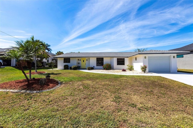 ranch-style home with a garage, stucco siding, concrete driveway, and a front yard