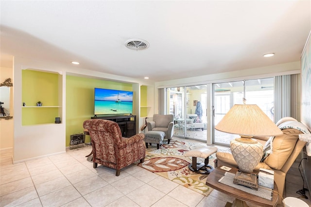 living room with baseboards, light tile patterned flooring, visible vents, and recessed lighting