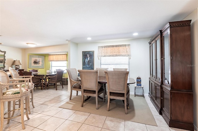 dining area with recessed lighting and light tile patterned floors