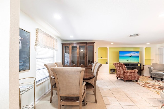 dining area featuring light tile patterned flooring, visible vents, and recessed lighting