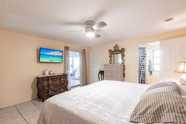 bedroom featuring light tile patterned floors, access to outside, and a ceiling fan