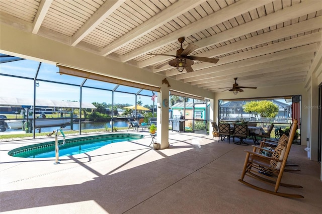 outdoor pool featuring a water view, area for grilling, a patio area, ceiling fan, and a lanai
