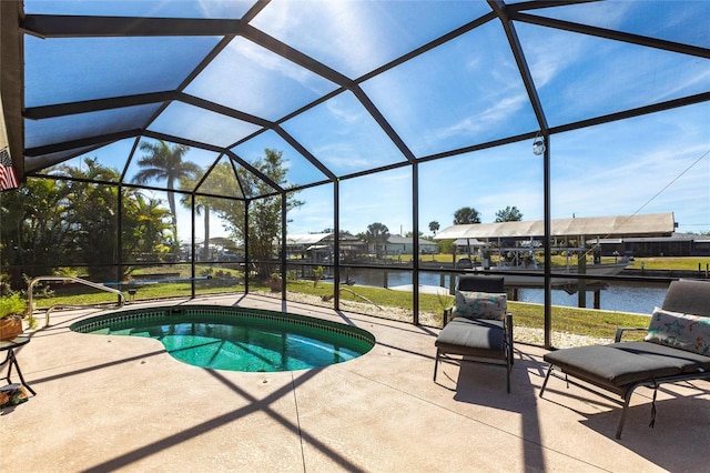 pool featuring a patio area, a lanai, and a water view