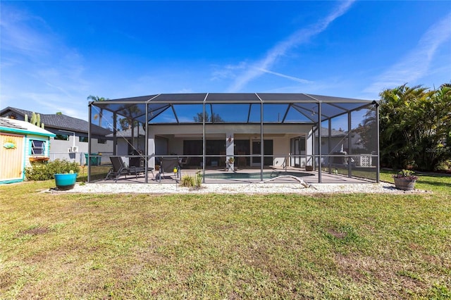 back of property with a patio, playground community, a lawn, glass enclosure, and an outdoor pool