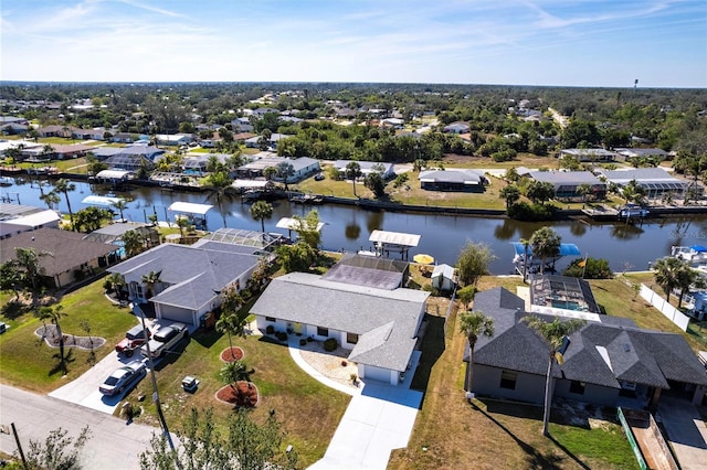 bird's eye view with a residential view and a water view