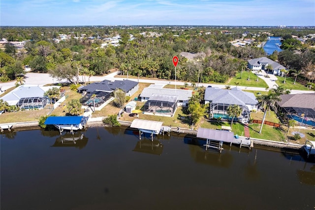 birds eye view of property featuring a water view and a residential view
