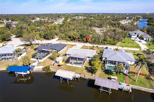 bird's eye view featuring a water view and a residential view