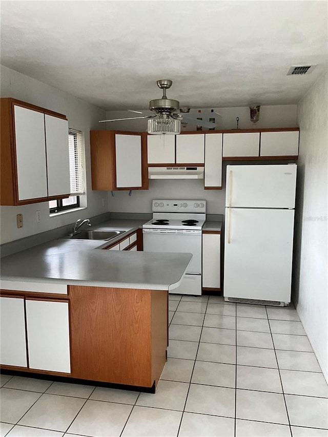 kitchen with white cabinetry, white appliances, and sink