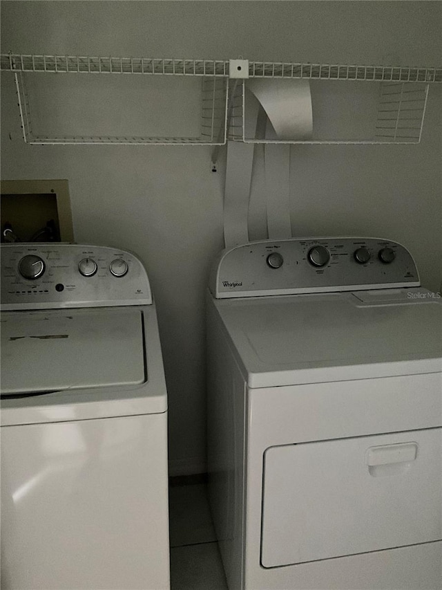 washroom with washer and clothes dryer